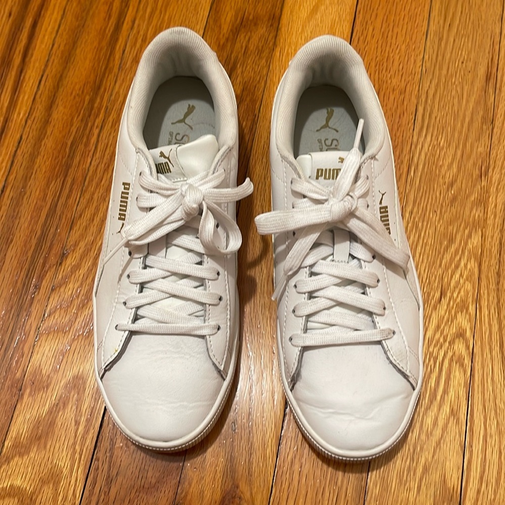 Women’s white Puma sneakers